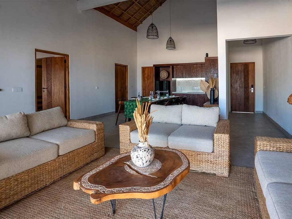 Luxury Beachfront Villa Interior in Sumba Luxury beachfront villa living room with natural wood accents and modern furnishings in Sumba.