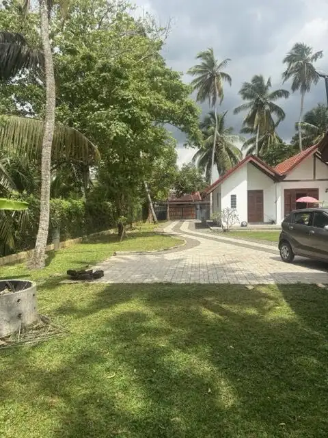 Beautiful estate featuring two houses in Waikkal, Sri Lanka, perfect for investment or family living.