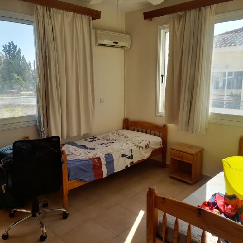 Bright bedroom with large windows and natural light in Aradippou, Larnaca. Ideal for comfortable liv.