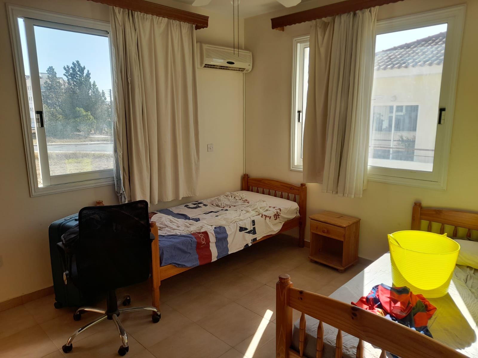 Bright bedroom with large windows and natural light in Aradippou, Larnaca. Ideal for comfortable liv.