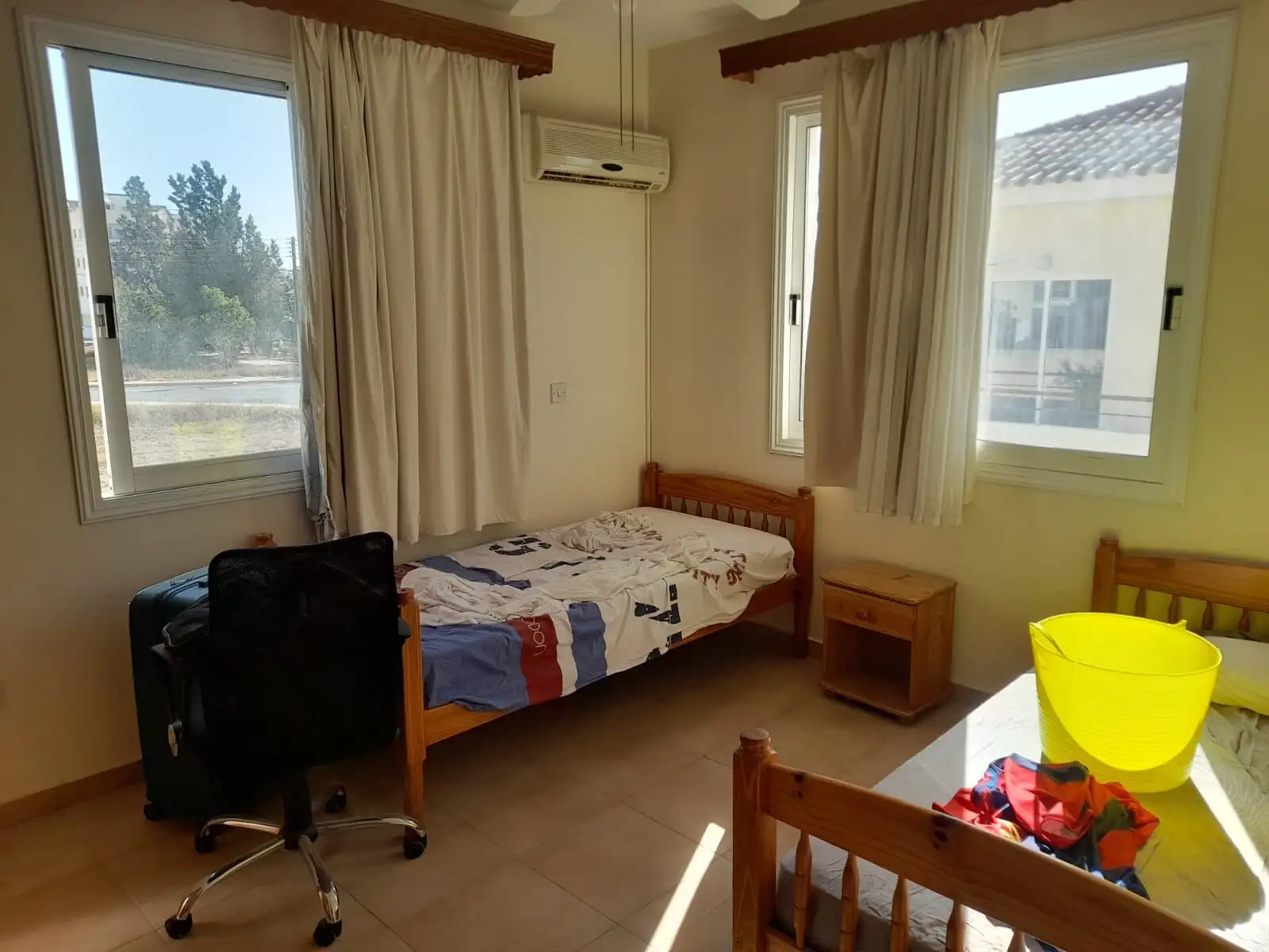 Bright bedroom with large windows and natural light in Aradippou, Larnaca. Ideal for comfortable liv.
