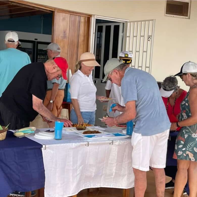 Restaurant dining scene with people enjoying food at Martin’s restaurant in Ponta Preta Maio Cape.