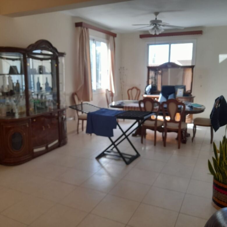 Spacious living and dining room with elegant furniture and natural light in Aradippou, Larnaca.