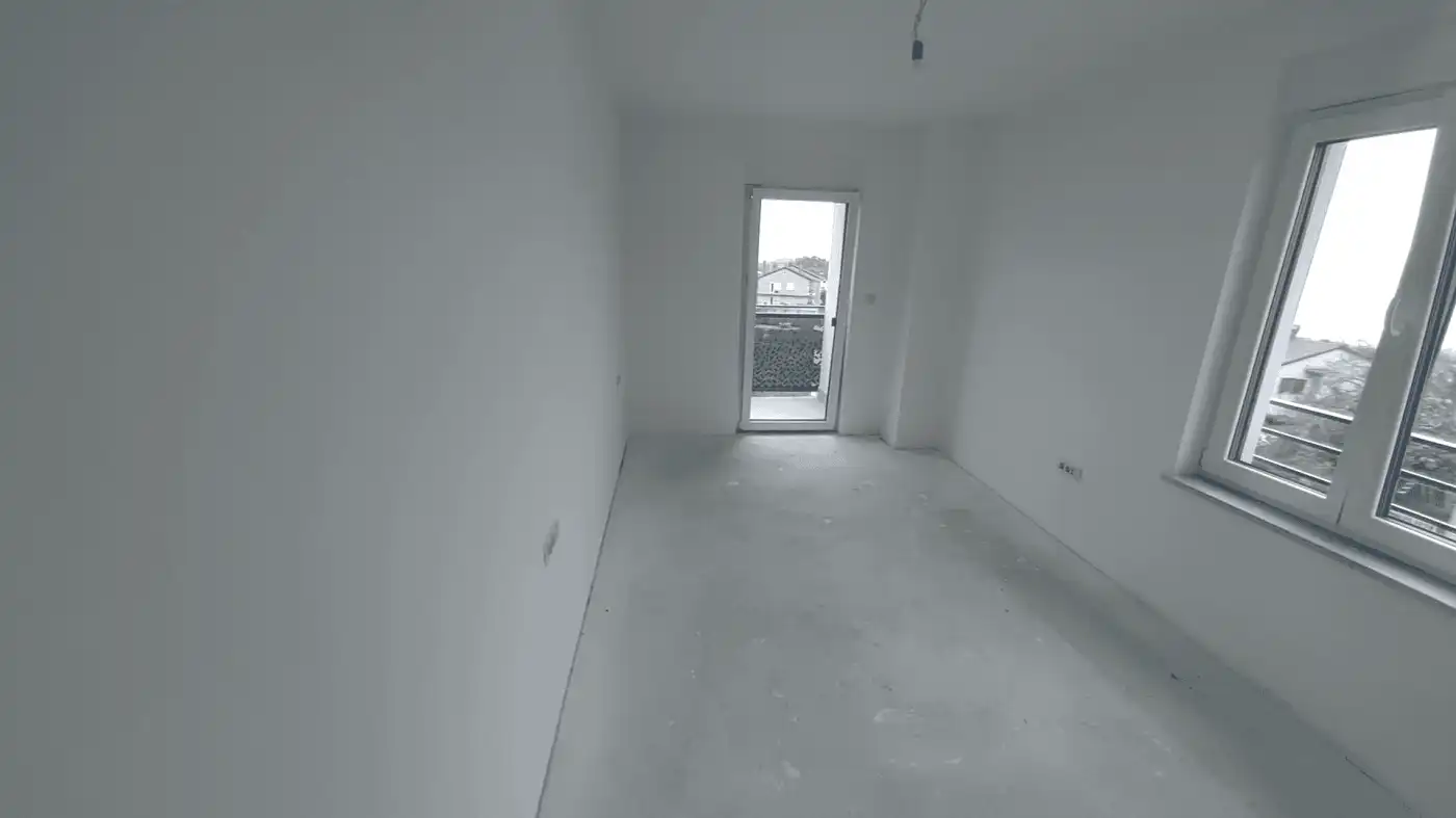 Modern interior of a duplex in Kvarner, near Rijeka, under construction. Interior of a new duplex apartment in Kvarner, Croatia, with large windows and bright space.