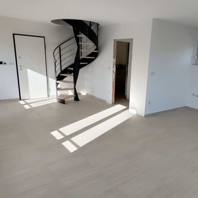 Bright, spacious duplex interior with large windows and modern design in Kvarner, near Rijeka.
