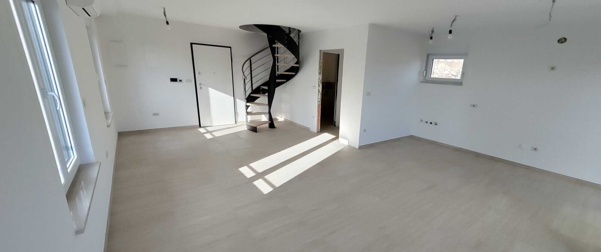 Bright, spacious duplex interior with large windows and modern design in Kvarner, near Rijeka.