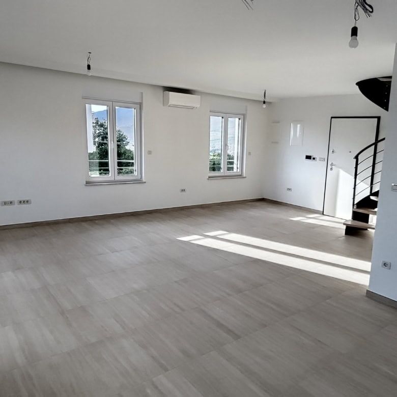 Bright, spacious duplex interior with large windows in Kvarner near Rijeka.