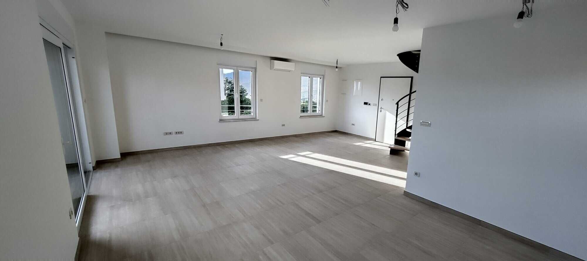 Bright, spacious duplex interior with large windows in Kvarner near Rijeka.