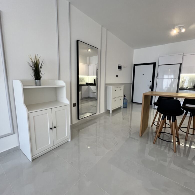 Bright modern 1+1 apartment interior in Caesar Resort near Long Beach.