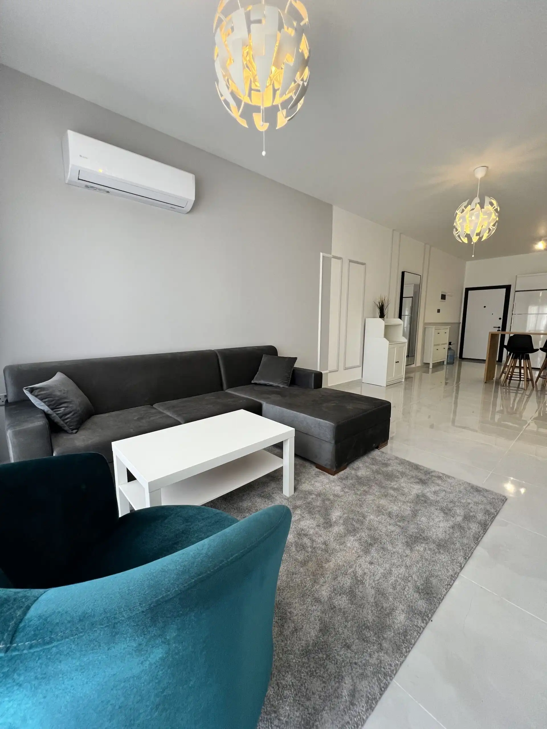 Stylish living room in a modern 1+1 apartment at Caesar Resort, Iskele.