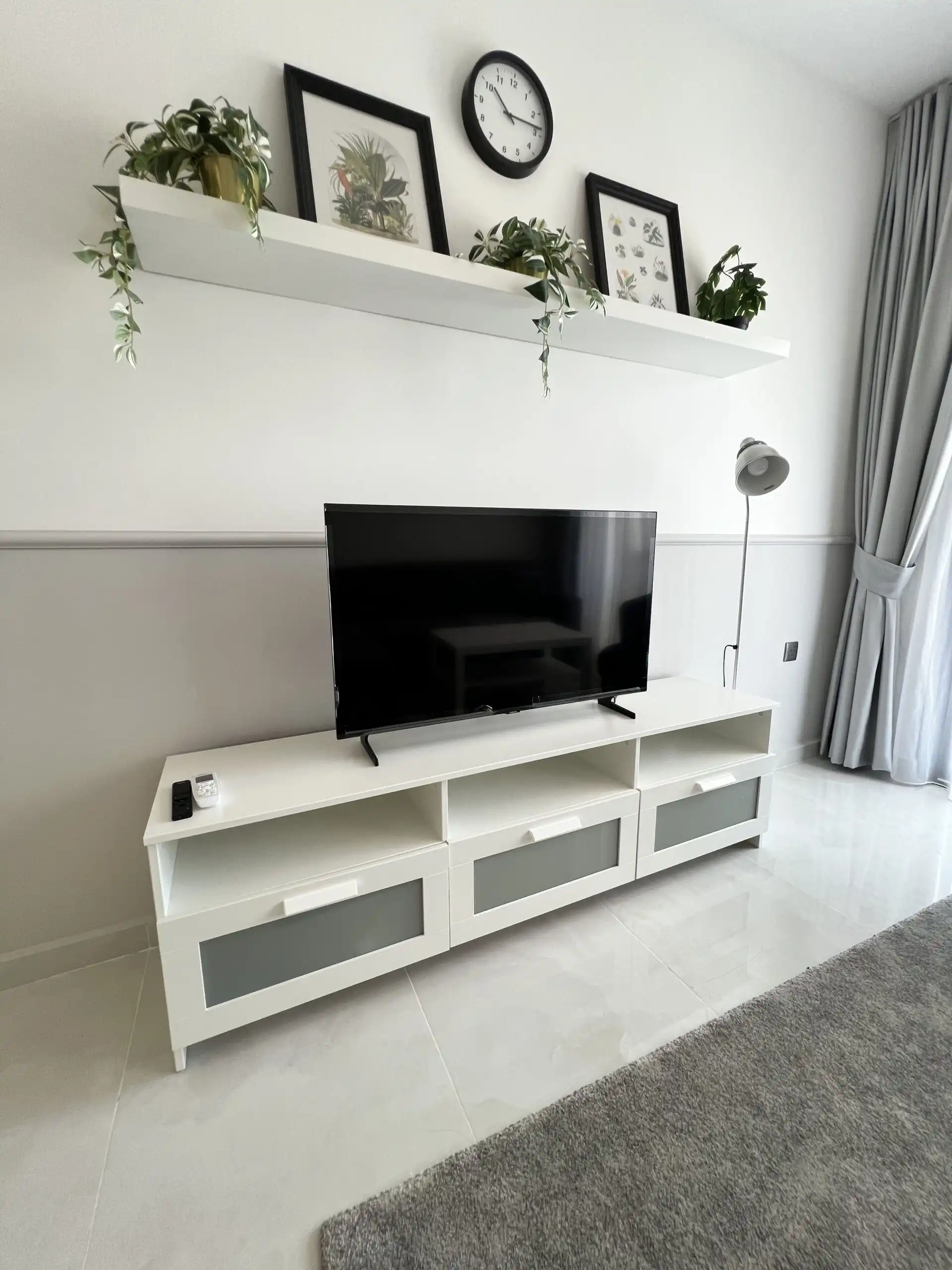 Stylish living room with TV and decorative wall art in Caesar Resort, Iskele.