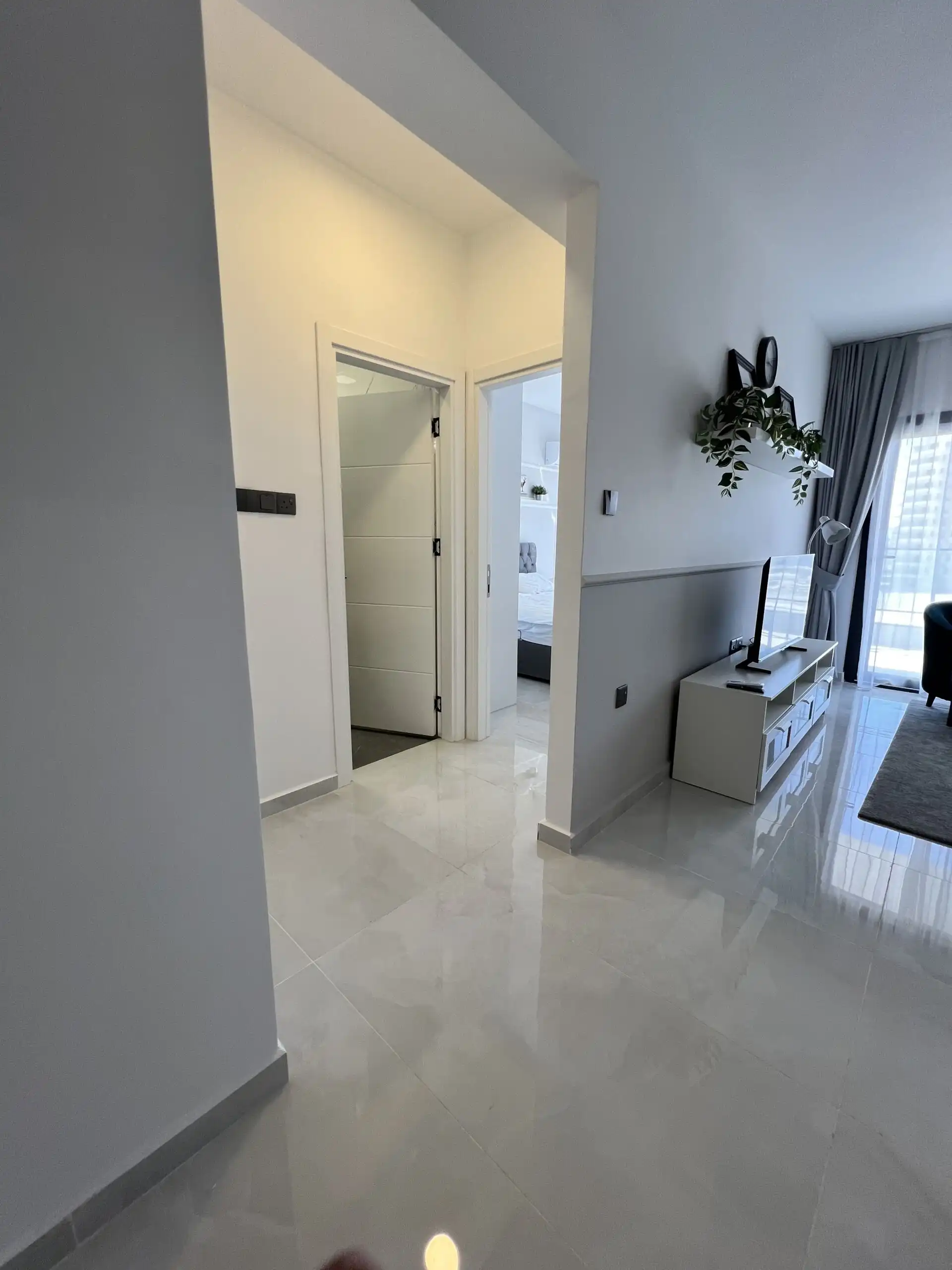 Apartment interior with living area and modern decor in Caesar Resort, Iskele.