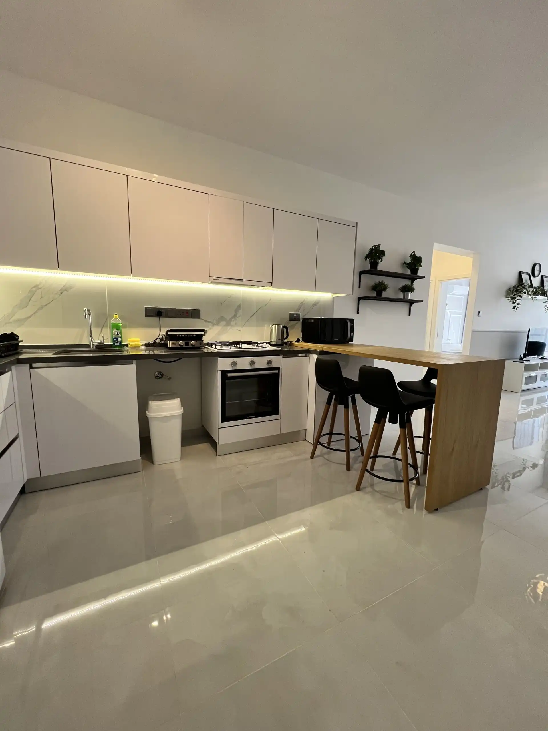 Contemporary kitchen in a modern 1+1 apartment at Caesar Resort, Iskele.