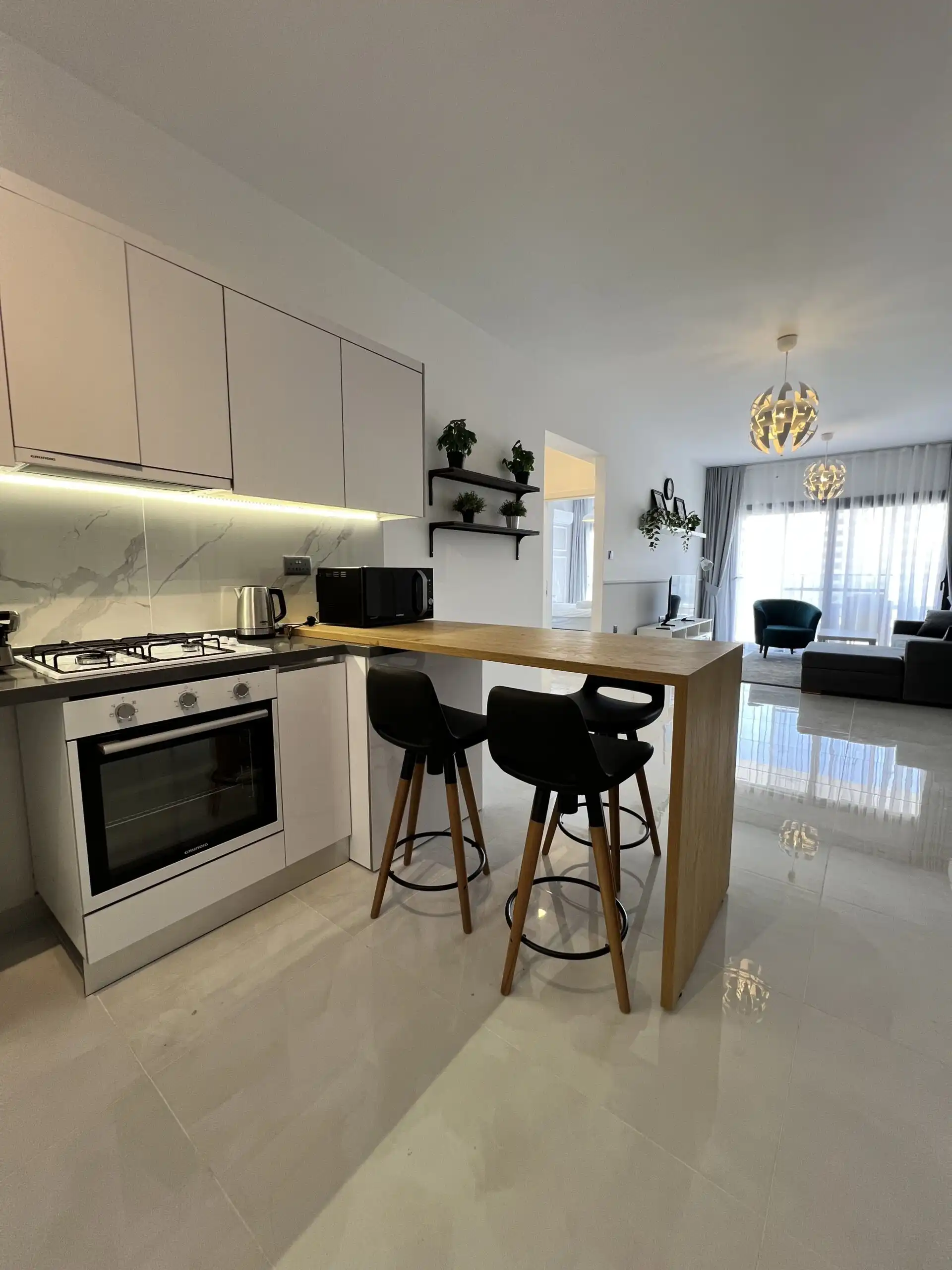 Contemporary kitchen and living area in Caesar Resort, Iskele near Long Beach.