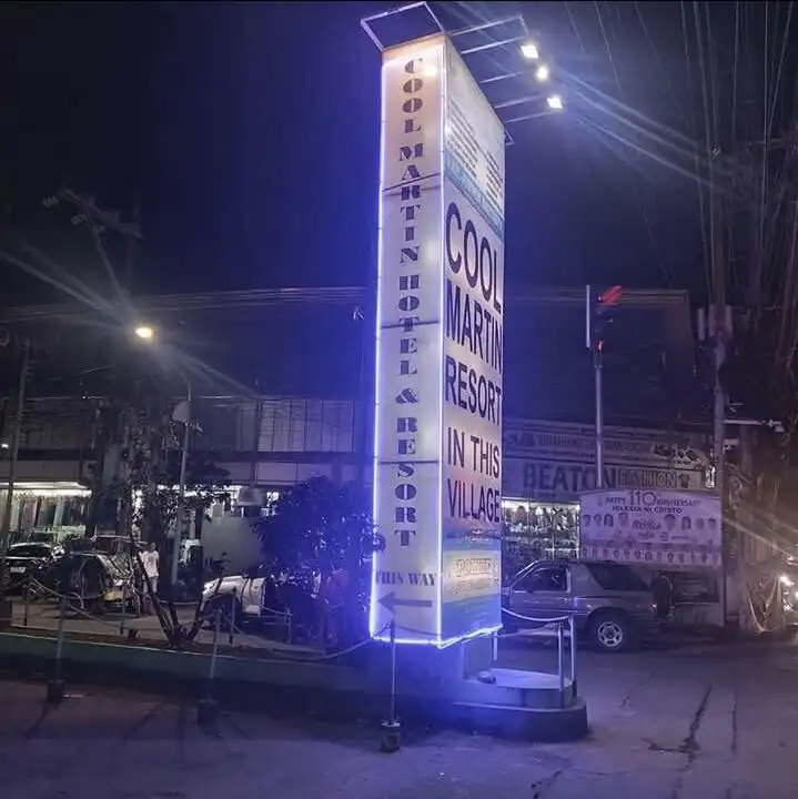 Resort hotel signboard at night in Cavite, Philippines.
