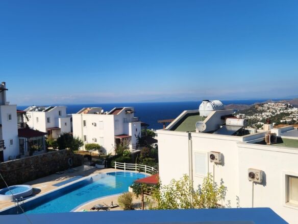 Sea view luxury 3-bedroom villa in Gumusluk, offering stunning views and modern amenities. Perfect f.