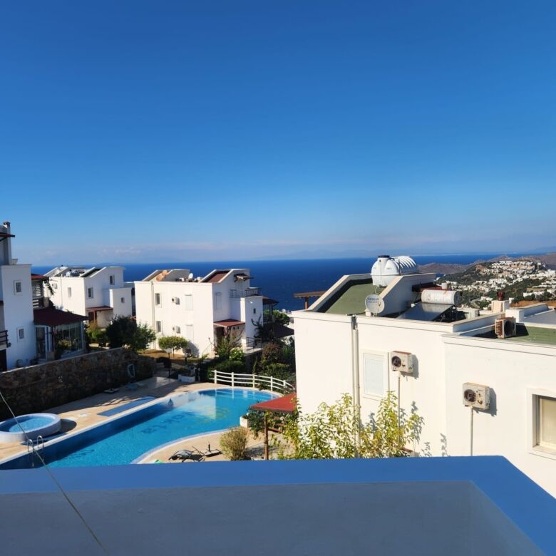 Sea view luxury 3-bedroom villa in Gumusluk, offering stunning views and modern amenities. Perfect f.