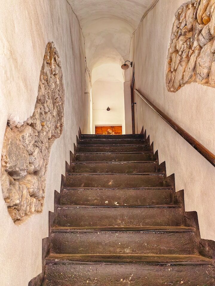 Cozy Stone Staircase in Historic Building Interior view of a rustic stone staircase in a historic building in Bordighera Alta, Liguria.