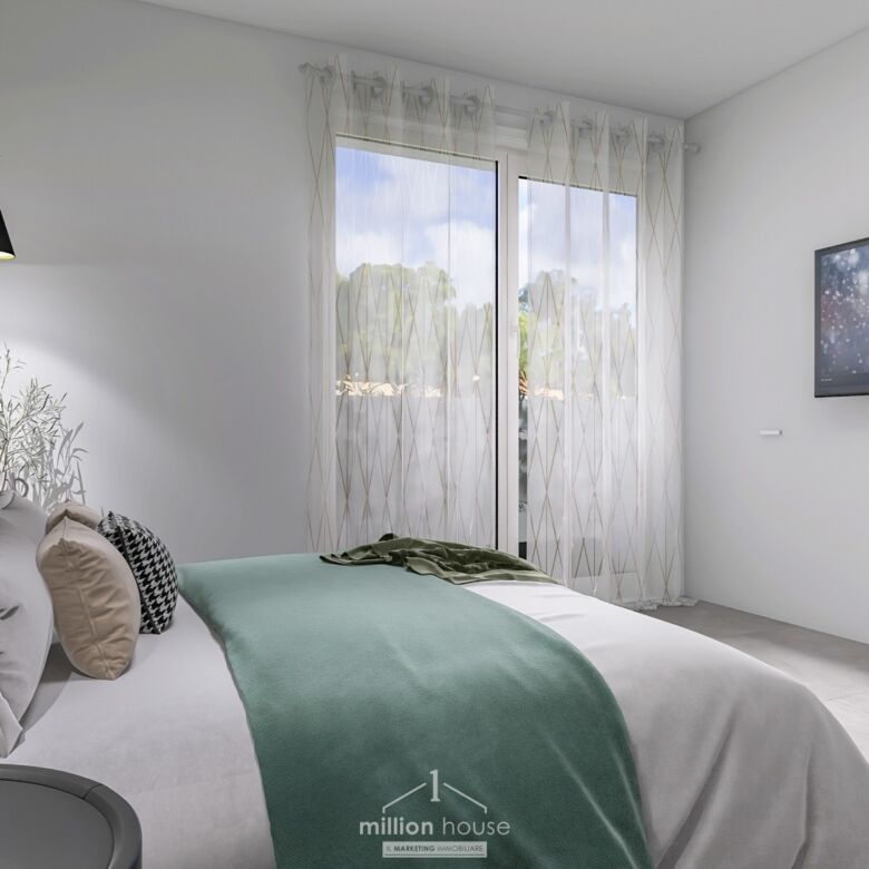 Spacious modern bedroom in Seregno Lombardy with elegant decor and natural light.