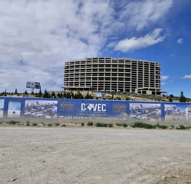 Construction luxury apartment building in North Cyprus with open sky.