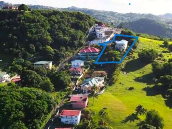 Beautiful hillside villa with lush greenery and scenic views in Prospect, St. Vincent.