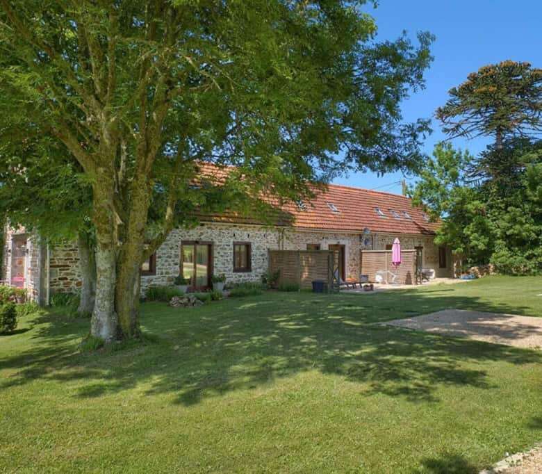 Charming stone country house with lush garden in Brittany, perfect for a peaceful retreat.
