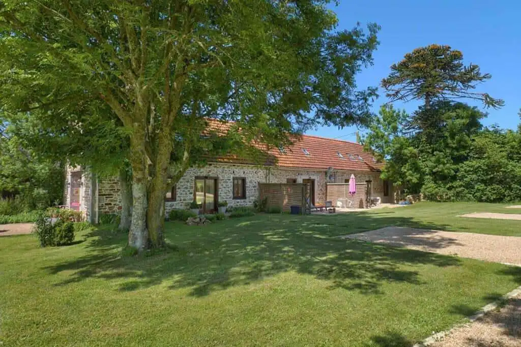 Charming stone country house with lush garden in Brittany, perfect for a peaceful retreat.