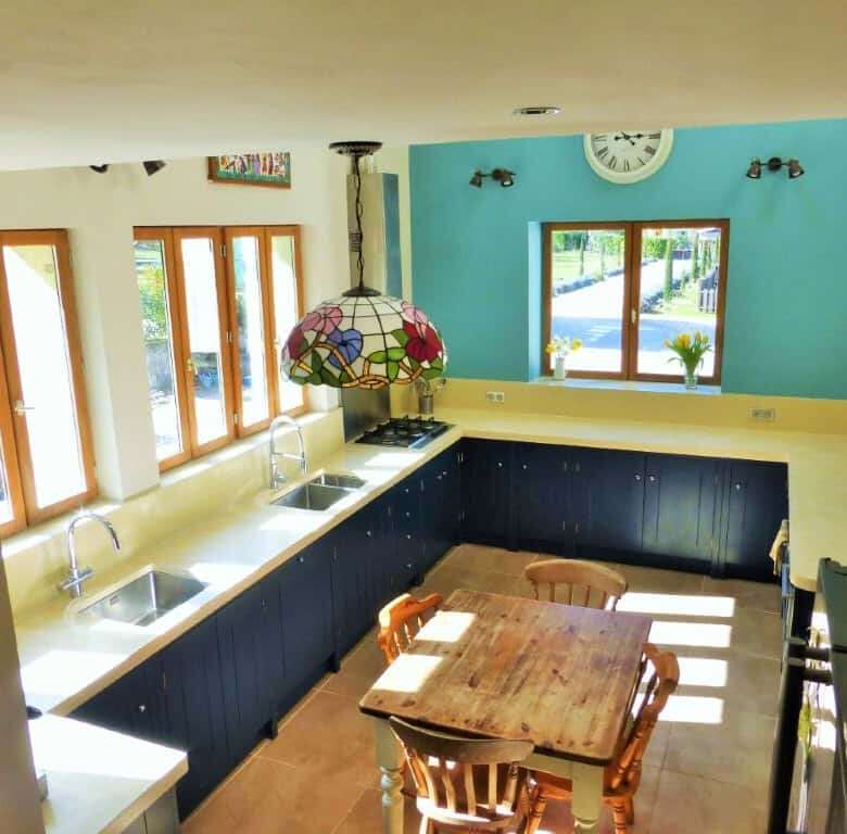 Chateau du Fraissinet country estate kitchen with modern appliances and colorful decor.