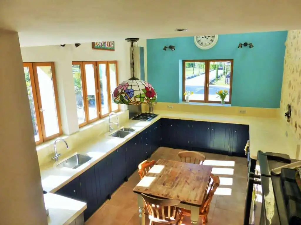 Chateau du Fraissinet country estate kitchen with modern appliances and colorful decor.