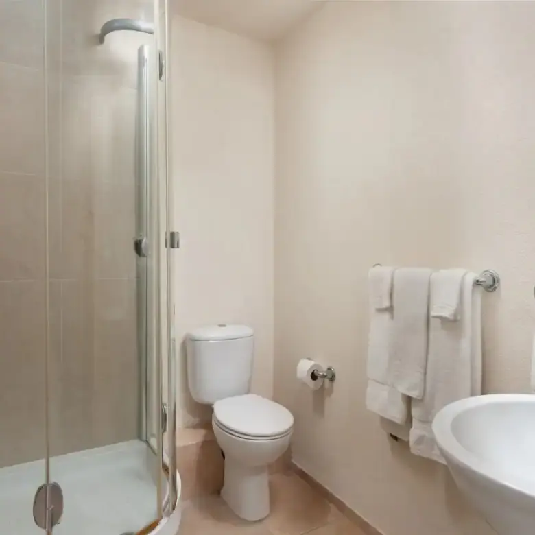 Modern bathroom with shower in St. Lawrence Beach apartment.