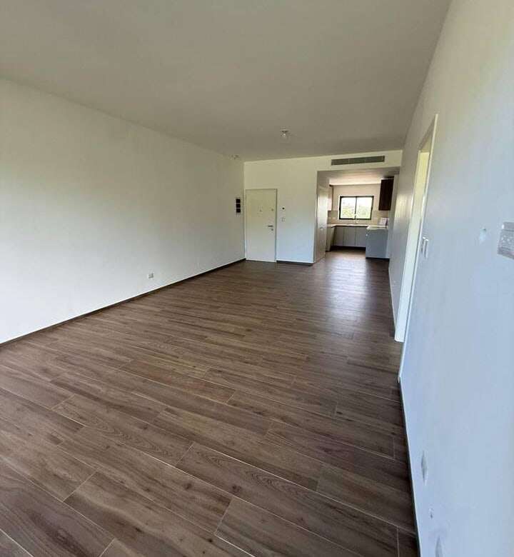 Apartment interior with open living space and wooden flooring in Punta Cana.