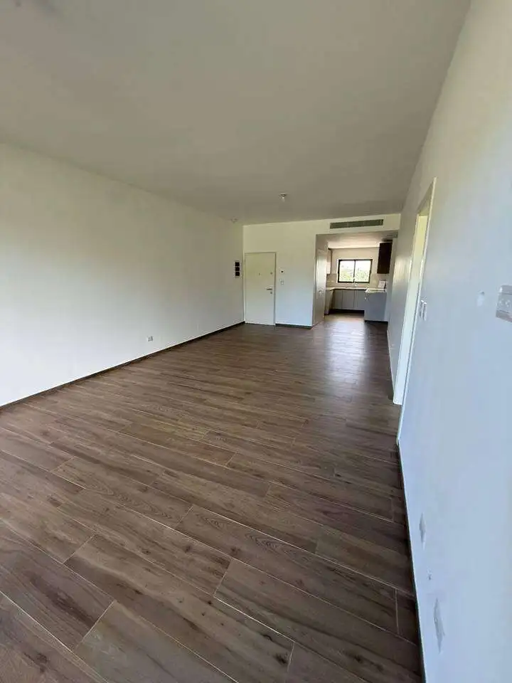 Apartment interior with open living space and wooden flooring in Punta Cana.
