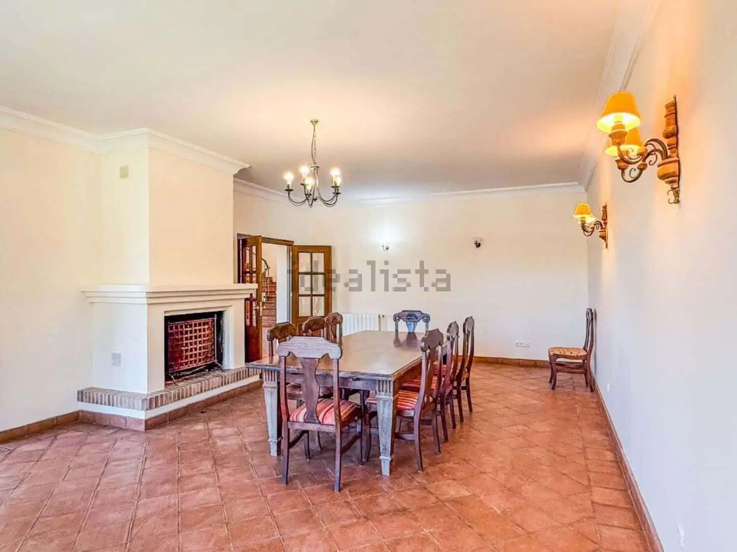 Spacious interior of a stunning 7-bedroom villa in Calle Fondo, Sotogrande, featuring a cozy firepla.