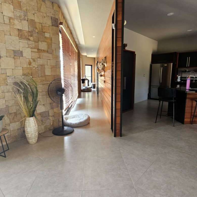 Spacious modern villa interior with open-plan living area and stylish decor in Miramar de Puntarenas.