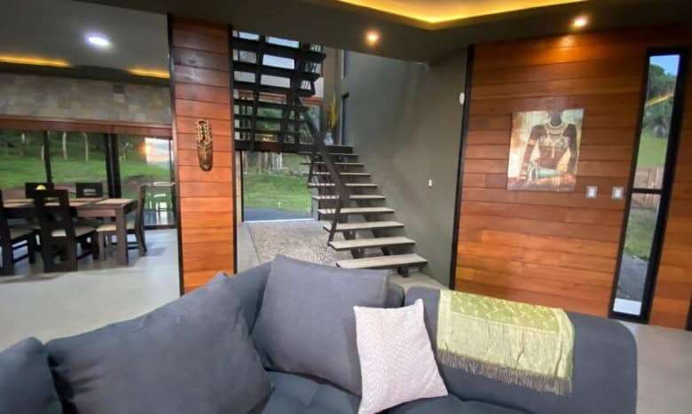 Stylish interior of a Costa Rican villa with wooden accents and modern furnishings.