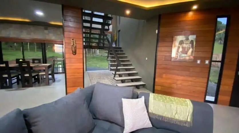Stylish interior of a Costa Rican villa with wooden accents and modern furnishings.