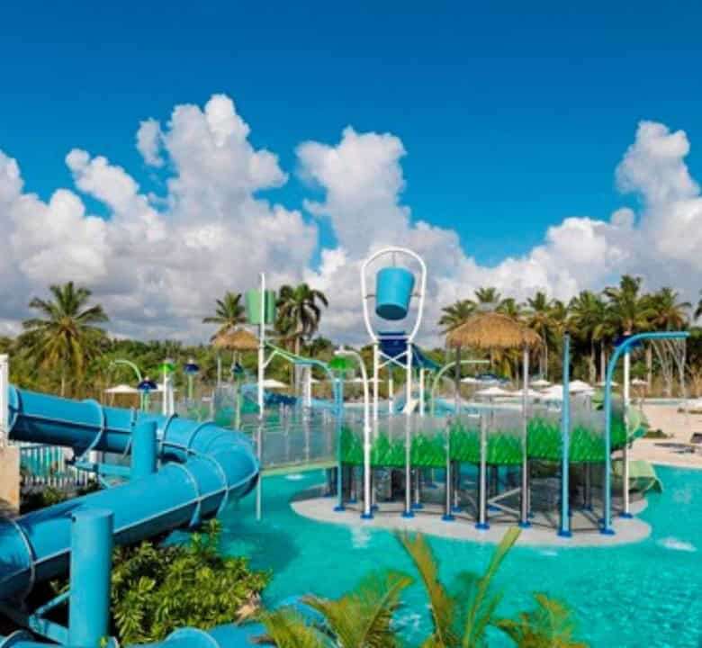 Water park with slides and splash zones at Coral Bahia Punta Cana resort.