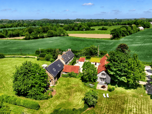Charming 10-bed Gites du Manoir complex for sale in Runan, Brittany, set in lush green countryside w.