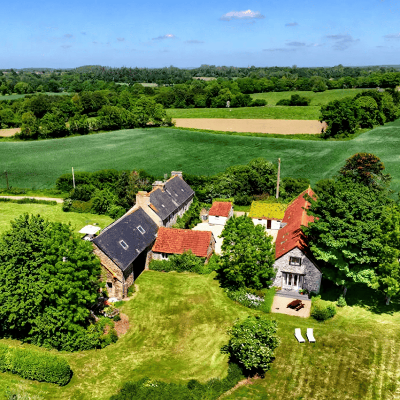 Charming 10-bed Gites du Manoir complex for sale in Runan, Brittany, set in lush green countryside w.