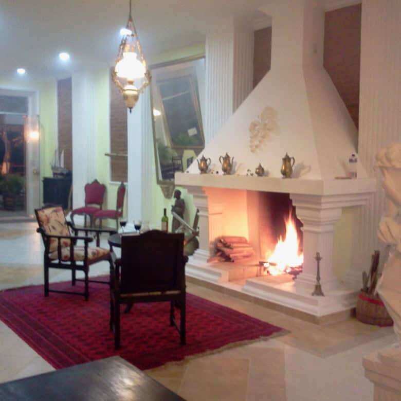Style living room with a cozy fireplace and elegant decor in Bahia.