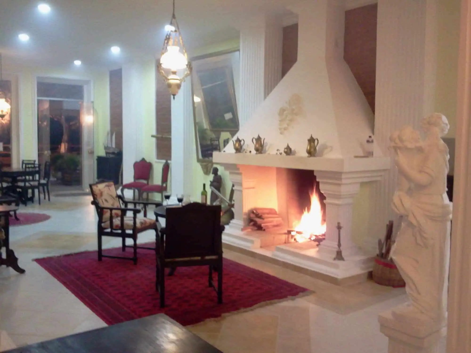 Style living room with a cozy fireplace and elegant decor in Bahia.