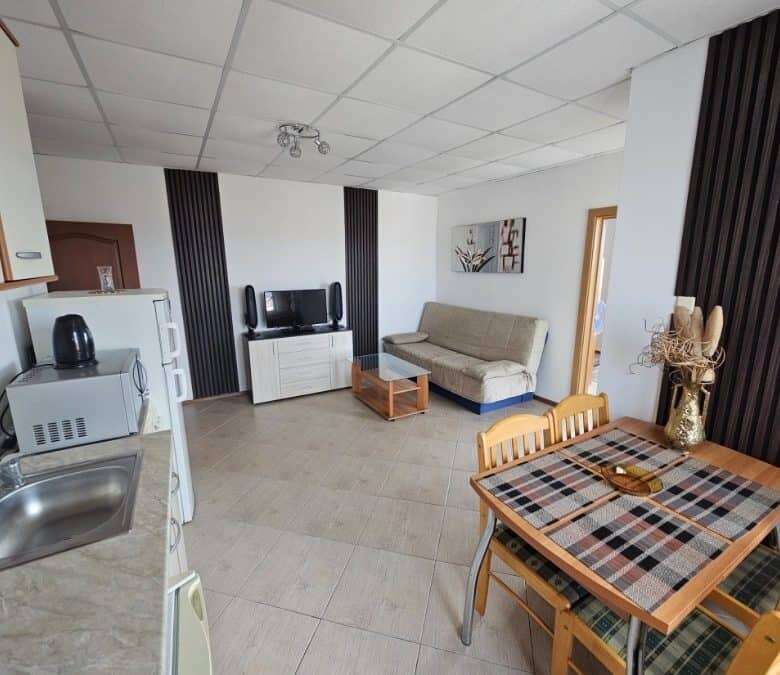 Bright 2-bedroom apartment in Sunny Beach with living area and kitchen.