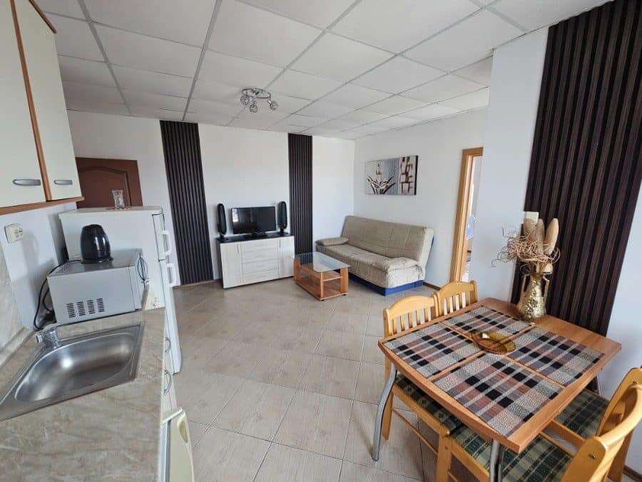 Bright 2-bedroom apartment in Sunny Beach with living area and kitchen.