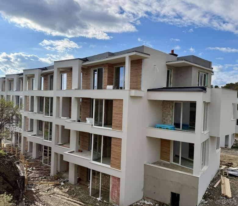 Modern Sveti Vlas apartment building with multiple balconies and large windows.