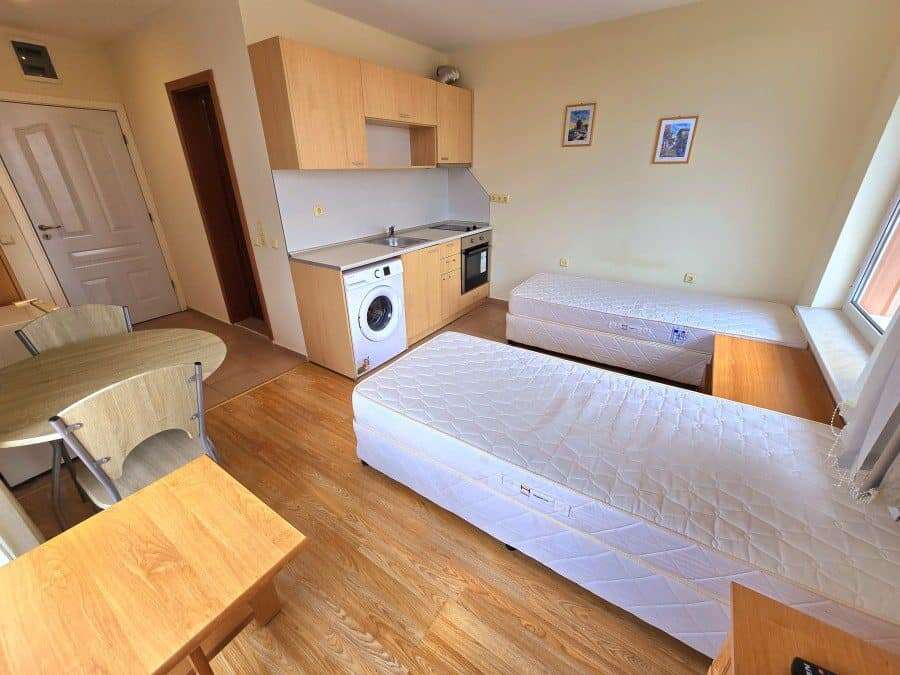 Studio apartment with pool view in Nessebar Fort club, Sunny Beach. Bright studio with pool view, compact kitchen, and cozy sleeping area in Nessebar Fort club.