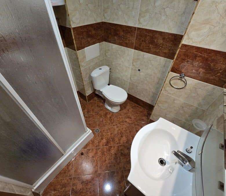 Bathroom with shower, toilet, and sink in Nessebar Fort club, Sunny Beach.