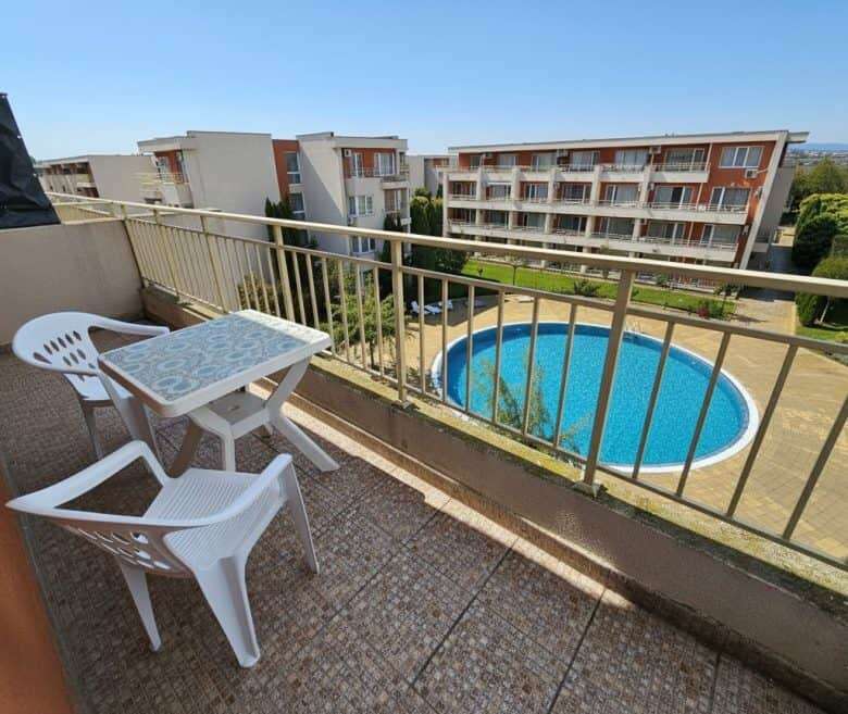 Balcony view of pool and surrounding apartments in Sunny Beach, Nessebar.