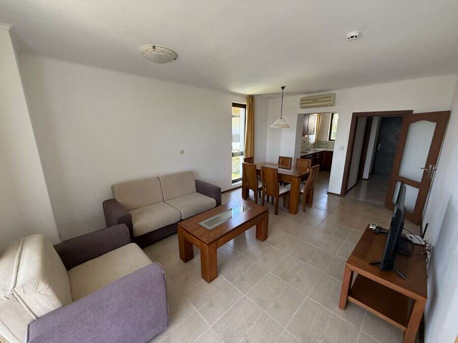 Spacious living room with comfortable sofas and a dining area in Bay View Villas, Kosharitsa, Bulgar.