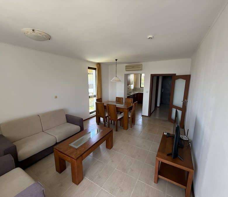 Spacious living room with seating area and dining space, close to the sea in Bulgaria.