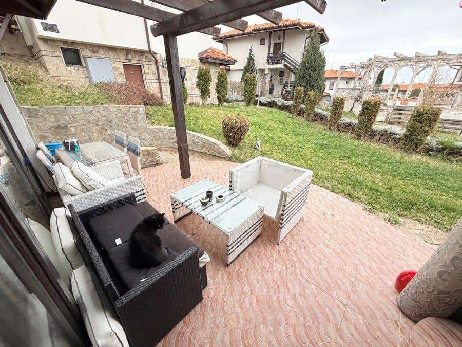 Modern outdoor patio with seating area in Bay View Villas, Bulgaria. Outdoor patio with comfortable furniture and garden view in Bay View Villas, Bulgaria.
